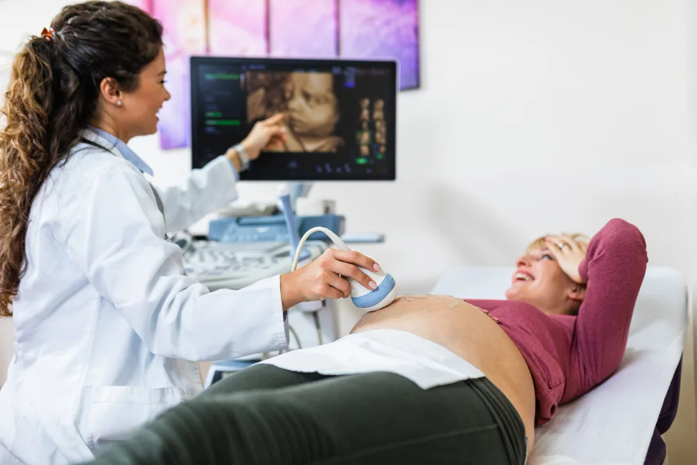 Expectant parents viewing a 3D/4D ultrasound image of their baby at Affordable Ultrasound Houston.