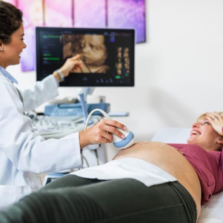 Expectant parents viewing a 3D/4D ultrasound image of their baby at Affordable Ultrasound Houston.